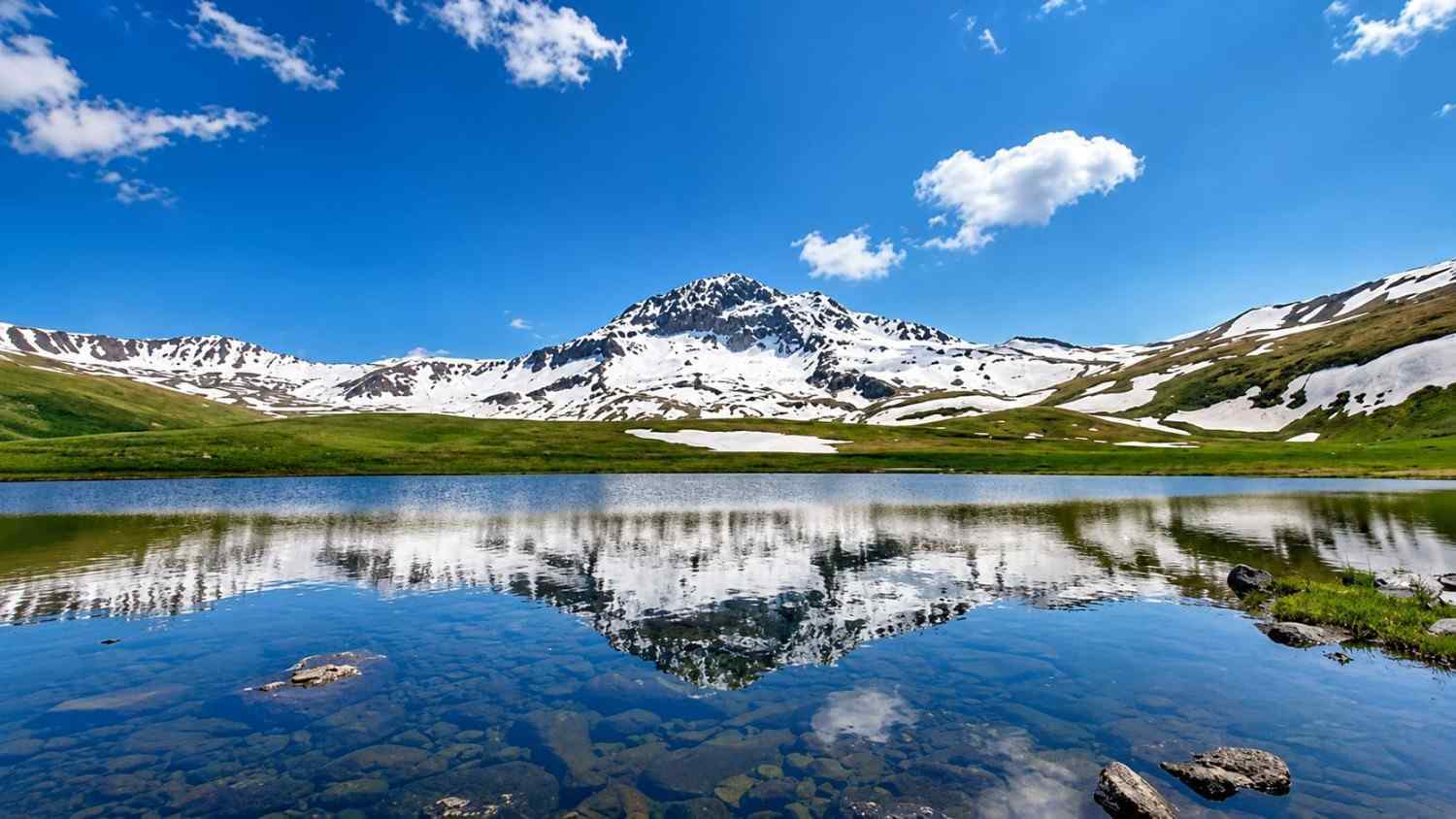 Rapi Lake surrounded by mountains on the northern slopes of Mount Aragats