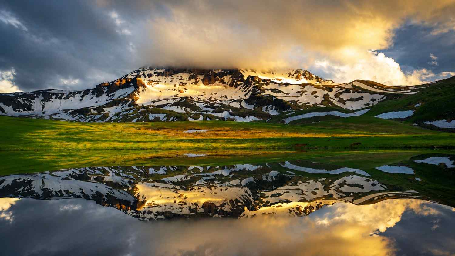 Golden hour over open highland tracks near Rapi Lake